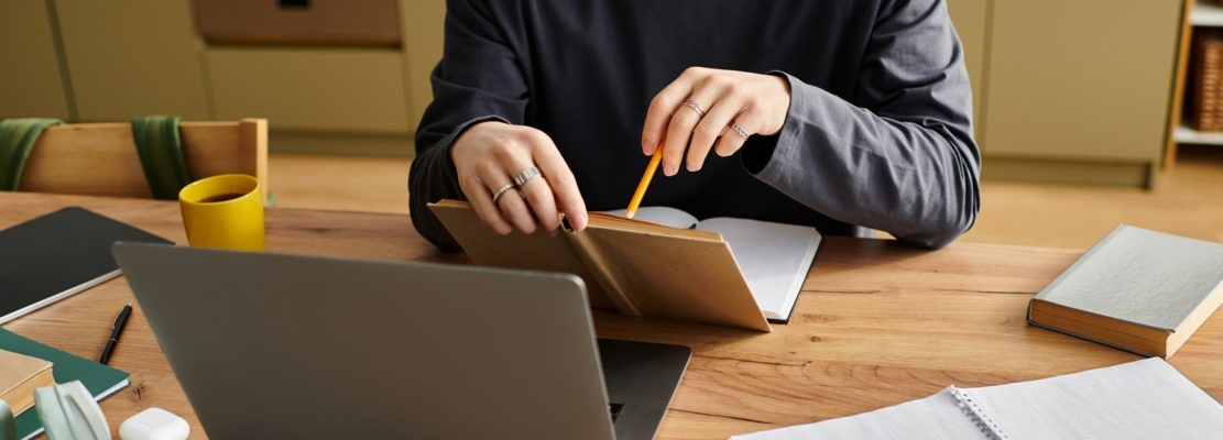 Studying diligently from home, a young asian man embraces online learning