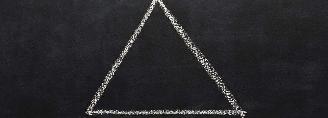 Triangle drawn with chalk on blackboard