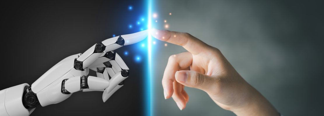 Robot and human hands pointing to each other.