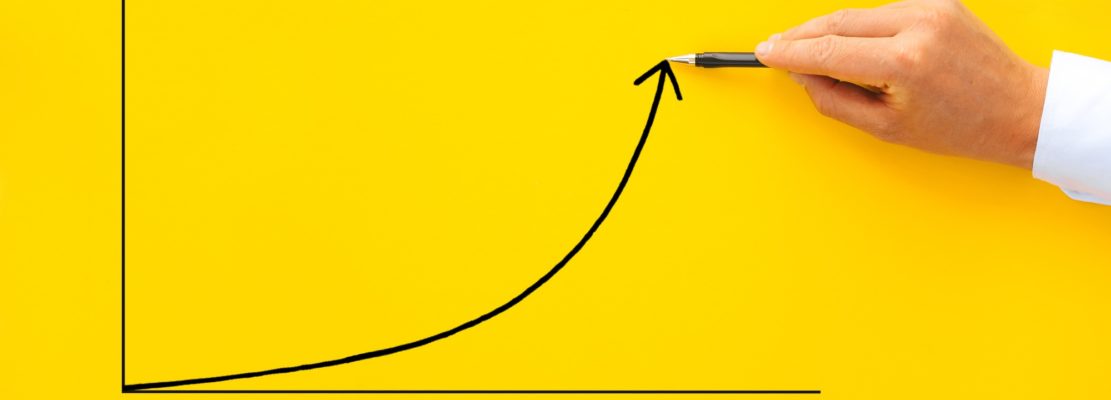 Businessman pointing arrow graph with pen. Business development to success, profit and growing growt