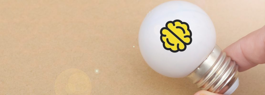 Symbol of Knowledge and Innovation: Brain Printed Inside Glowing Light Bulb