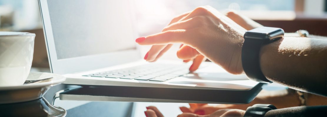 Woman hands using laptop in the office