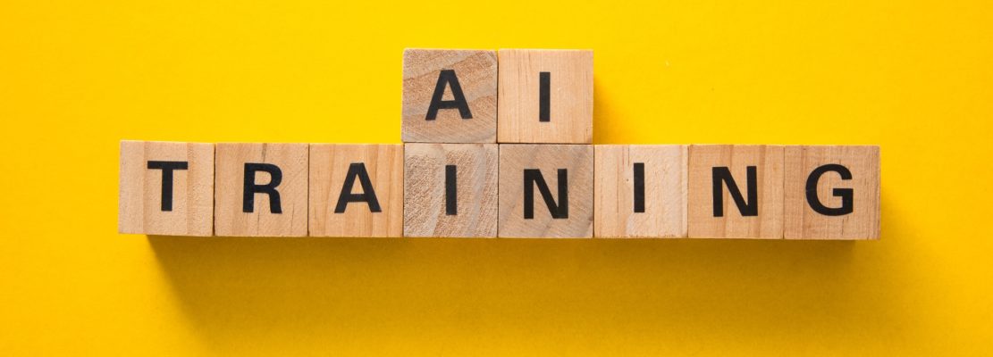 Ai training concept represented by wooden cubes on yellow background
