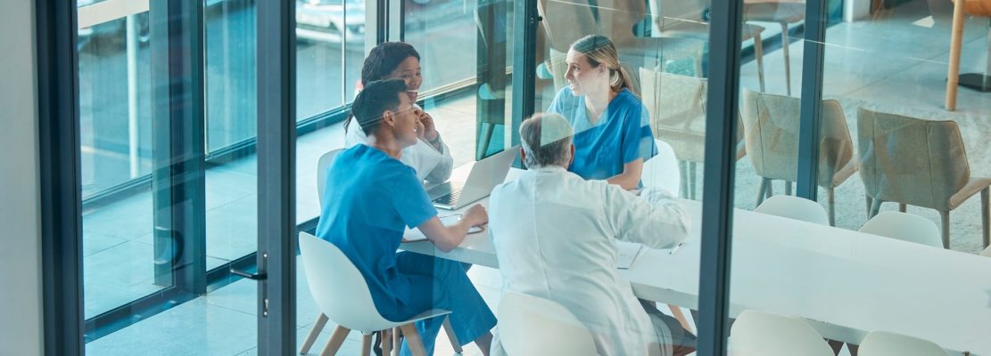 Theres so much to learn. Shot of a group of doctors in a meeting at a hospital.